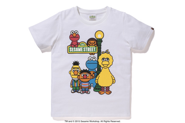 A children's white t-shirt with a graphic-style illustration of the Sesame Street charachters.