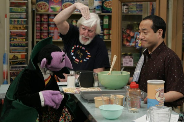 Carroll Spinney and Alan talk with the Count on the set of Sesame Street.