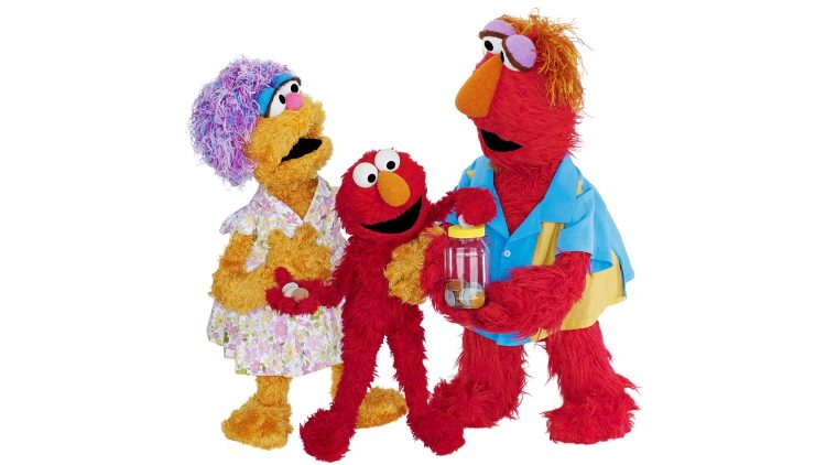 Elmo holds his mom's hand as he puts a coin into a jar, held by his father.
