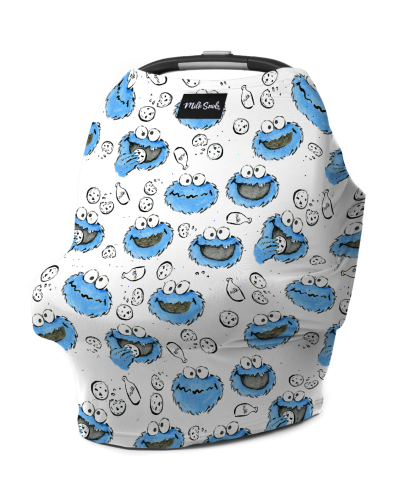 A car seat cover featuring a white background printed with Cookie Monster illustrations.