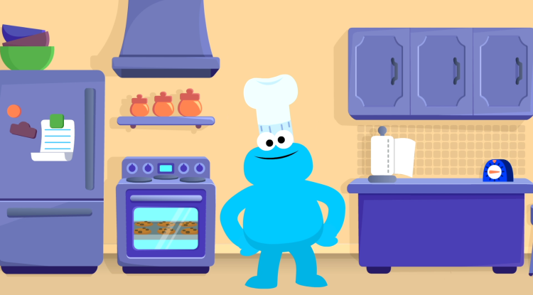 Cookie Monster wears a chefs hat and stands in a kitchen.