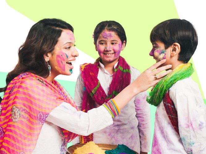 A parent face paints 2 children