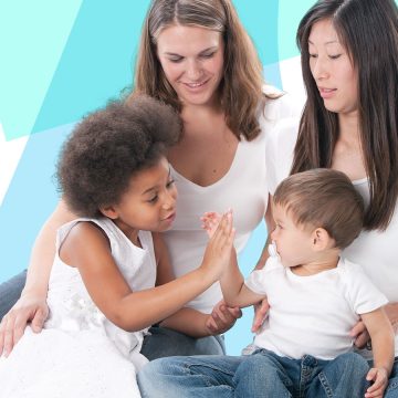 Two parents sit with their children