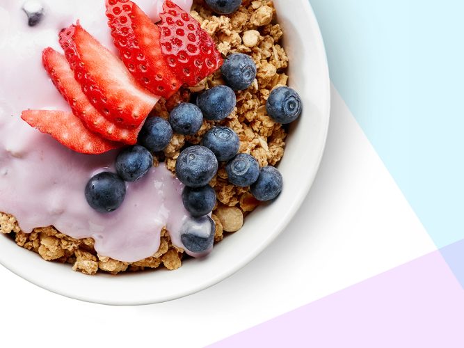 A bowl of granola and strawberries