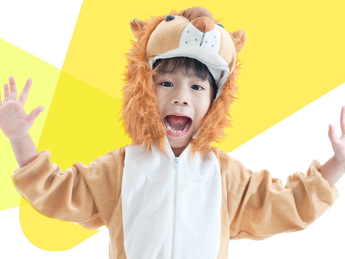 A child wearing a lion costume