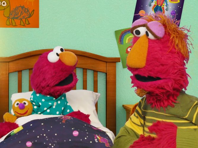 Elmo in bed talking to his dad Louis.