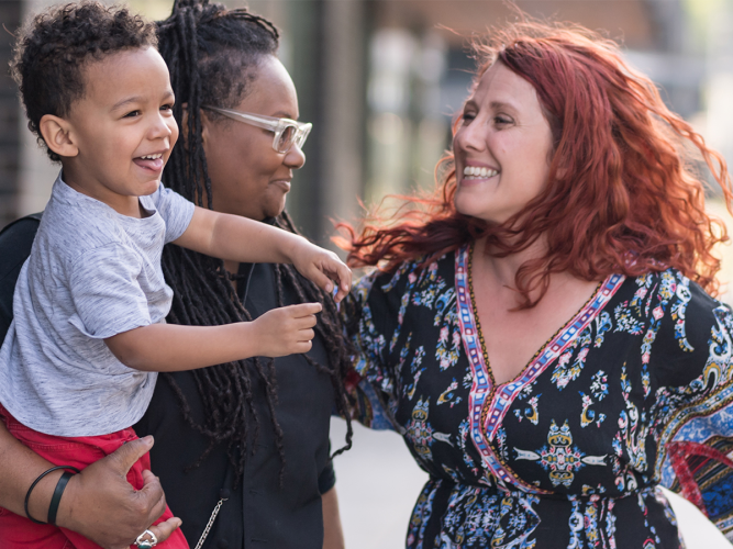 Parent, Provider and child engage in conversation.