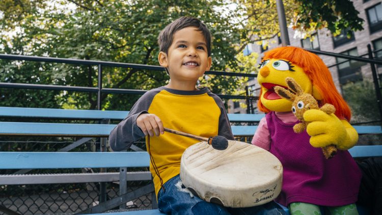 Julia and a child with a drum