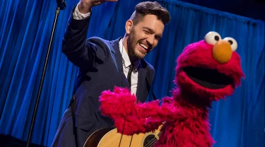 Andy Grammer with Elmo.