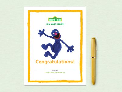 Grover leaps into the air above the word congratulations.
