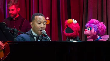 John Legend singing with Elmo and Abby.