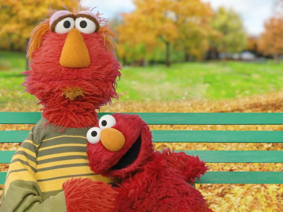 Elmo hugging his dad Louie on a Fall day.