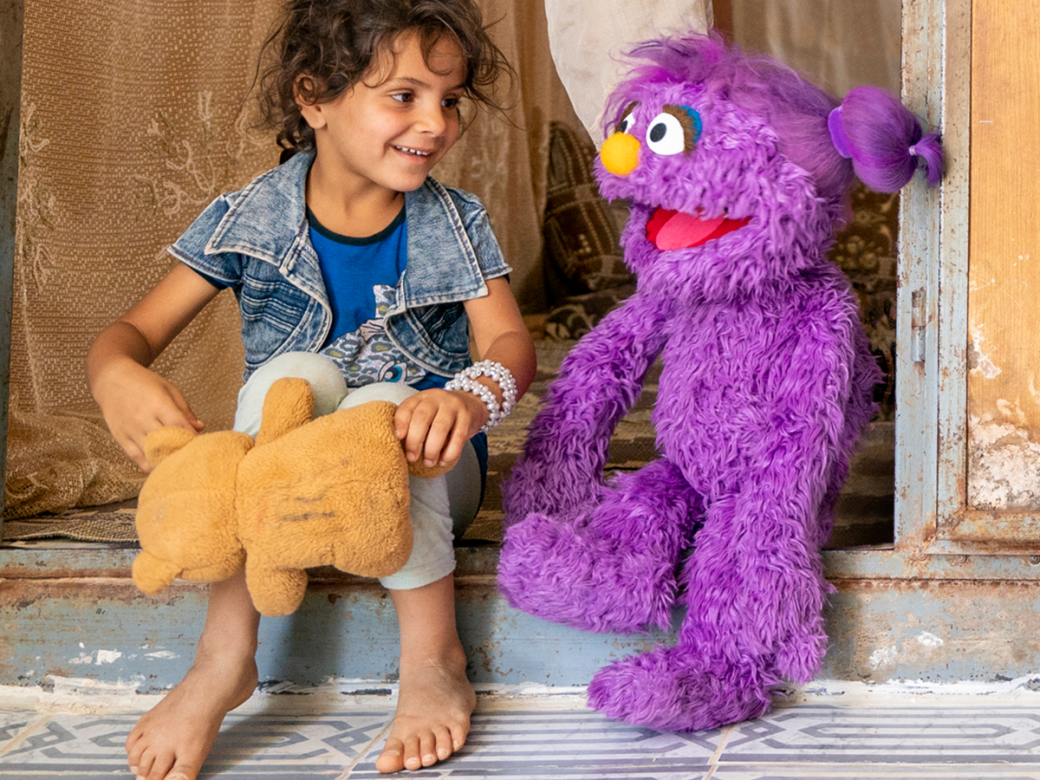 Basma and child with teddy bear.