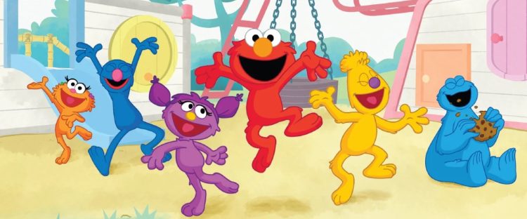 Elmo jumps joyously on the playground as other muppets look on.