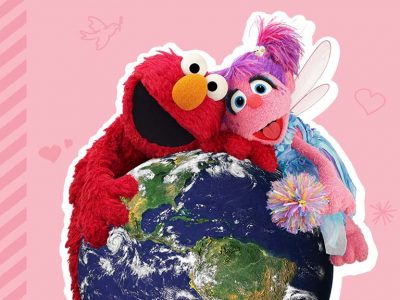Elmo and Abby hug a giant globe.