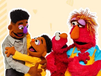 Wes and Elmo hug their respective fathers.