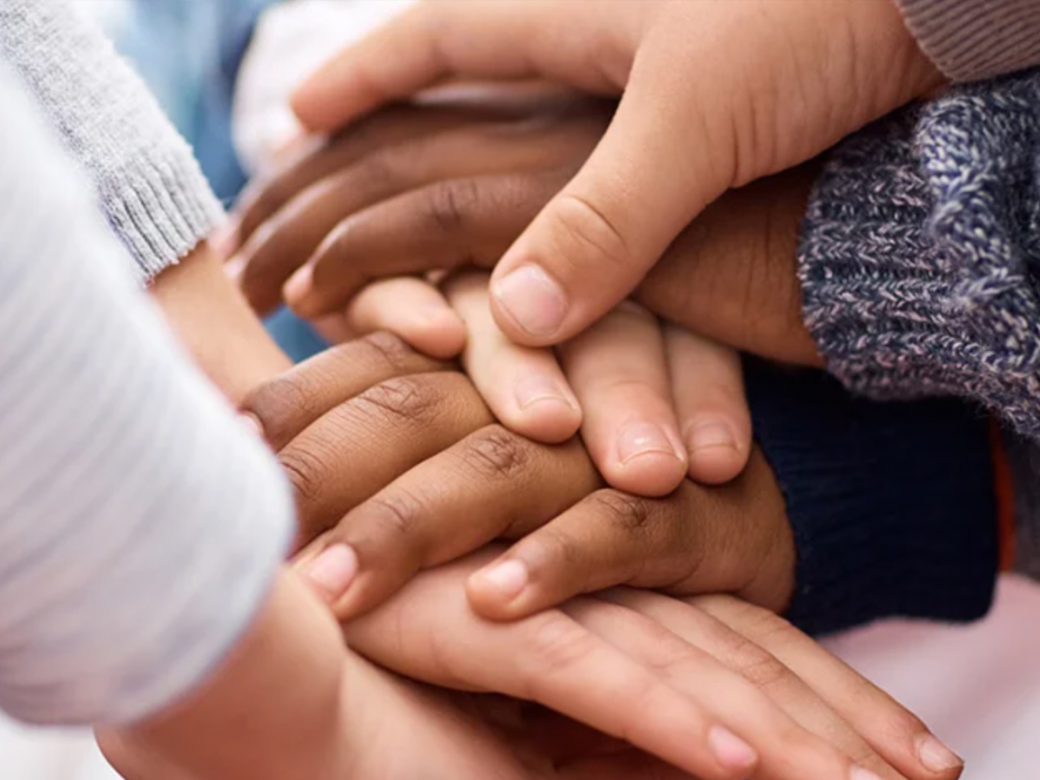 children's hands stacked.