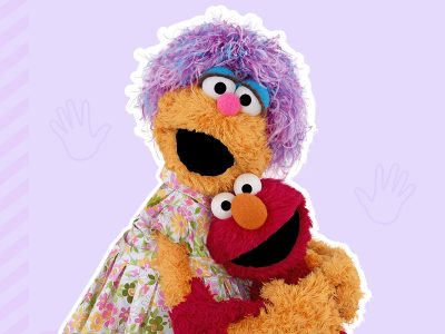 Elmo and his mom share a hug.