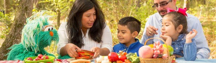 Rosita at a picnic with a family