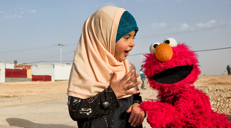 Elmo and a young girl.