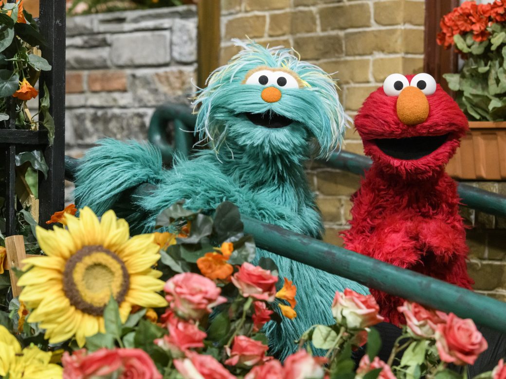 Rosita and Elmo pose on a ramp