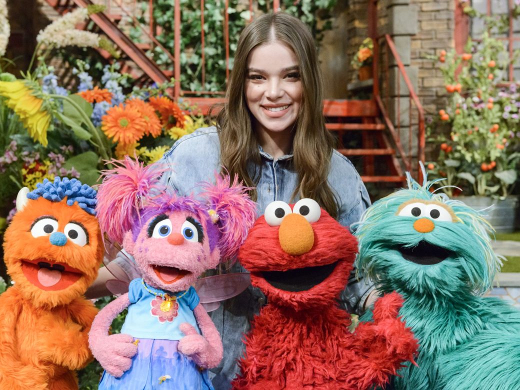 Hailee Steinfeld poses with Rudy, Abby, Elmo, and Rosita