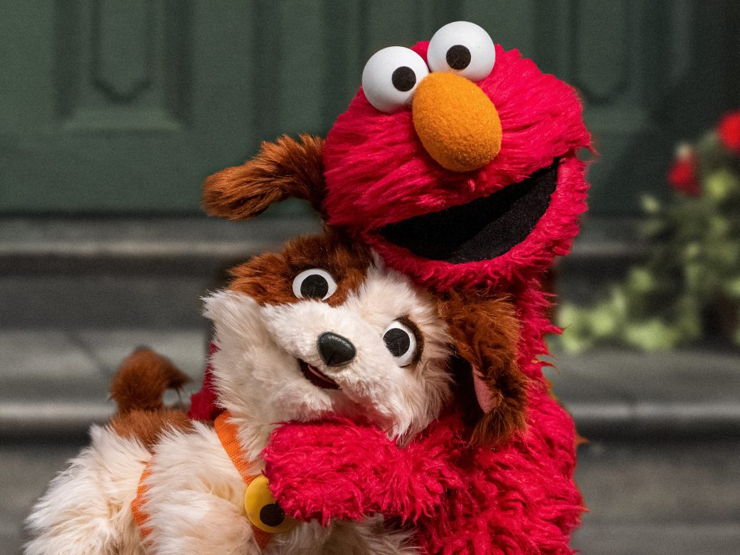 Elmo and Tango pose together