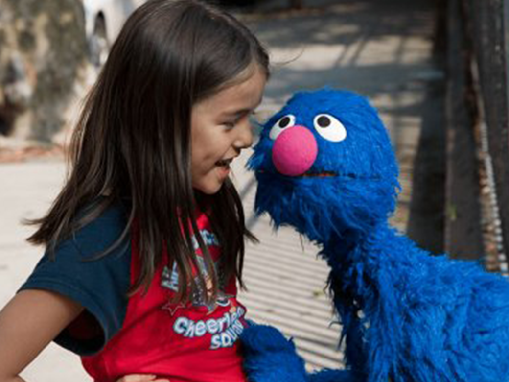 Grover and a young girl.