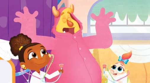 Roy is dressed in a pink onesie while Esme and Ooga, dressed as doctors, use stethoscopes on him.
