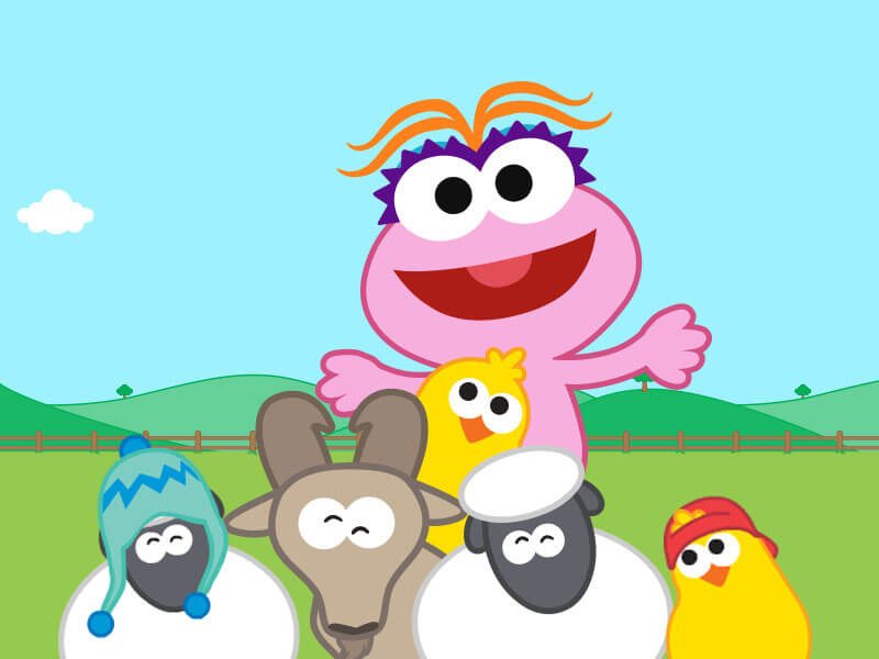 Lola is surrounded by farm animals wearing funny hats.