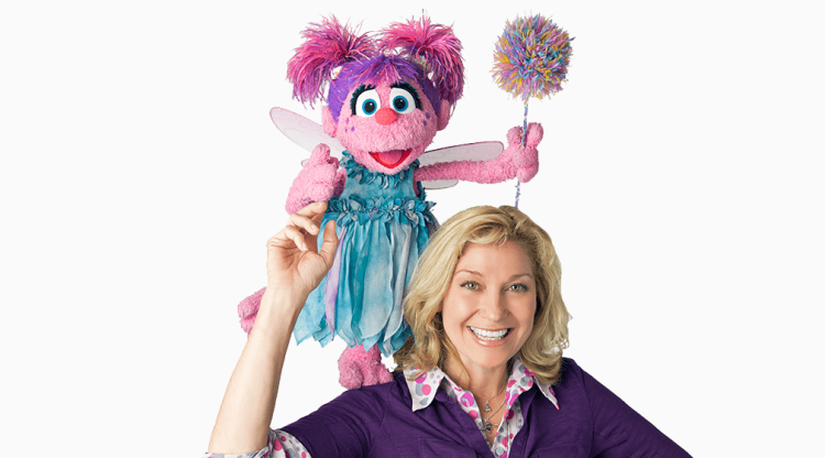 Picture of Leslie Carrara-Rudolph with Abby Cadabby.