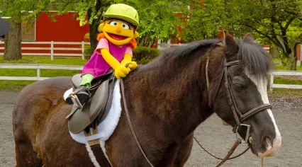 Julia rides a real-life horse.