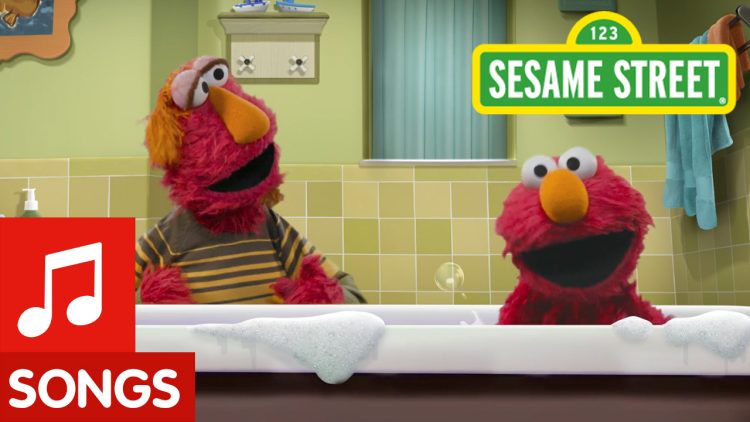 Louie gives Elmo a bath