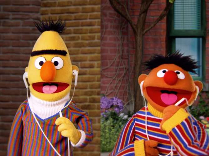 Bert and Ernie talking on headphones.