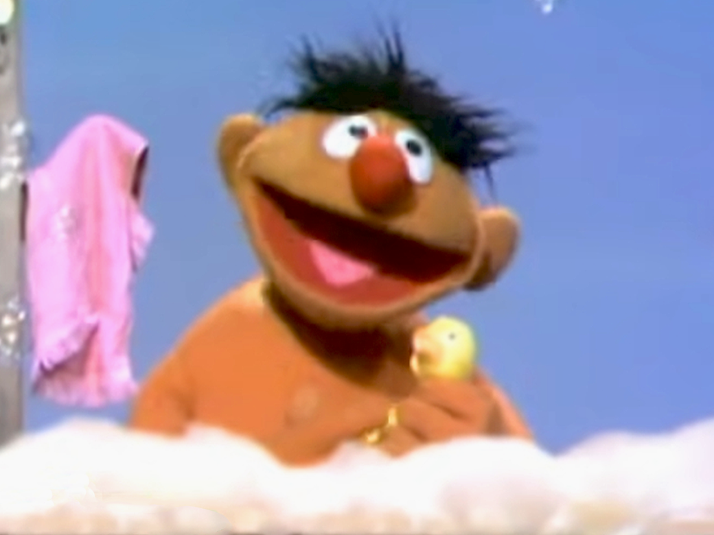 Ernie in the bath with his rubber duckie.