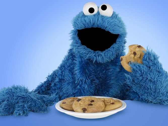 Cookie Monster eating cookies.