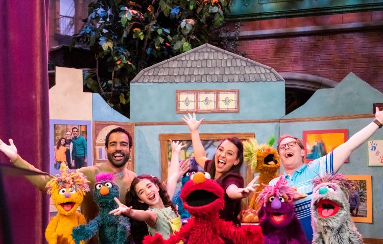 Nina, Dave, Frank and Mia singing with Elmo and friends about families.