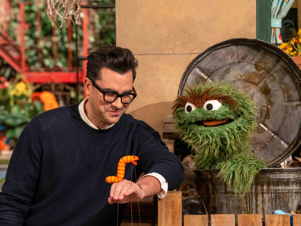 Dan Levy, Slimey the worm, and Oscar the grouch.