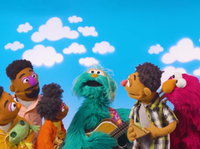 A group of Muppets listen to Rosita playing the guitar