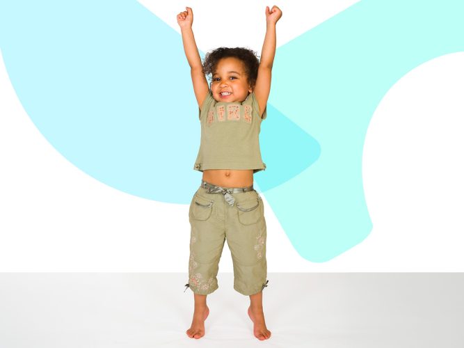 A child holds their arms up in a stretch