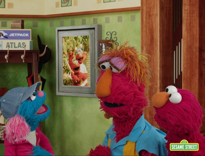 Louie and Elmo talk with a muppet and her parent