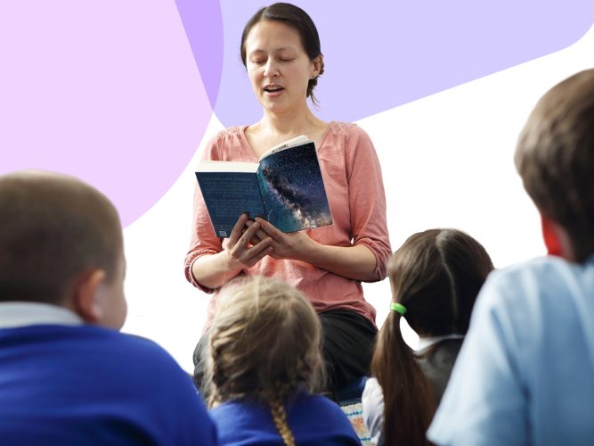 An adult reads aloud to a class of students