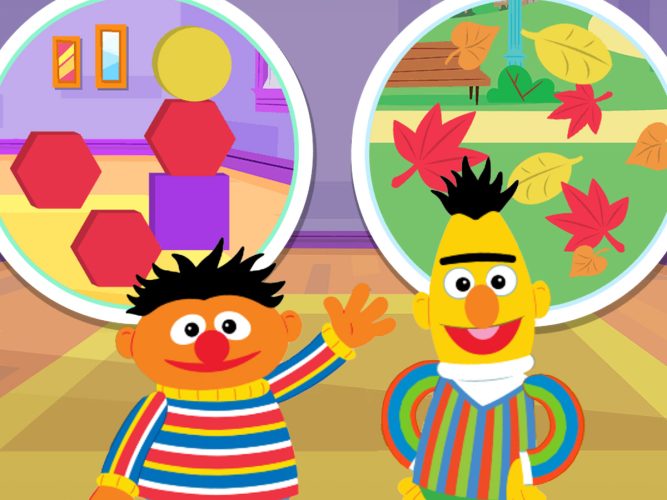 Bert and Ernie surrounded by blocks and leaves.