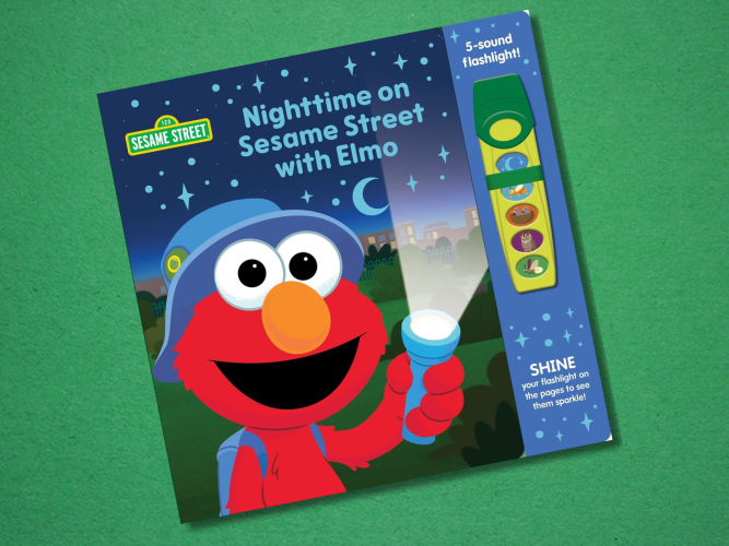Elmo holding a flashlight