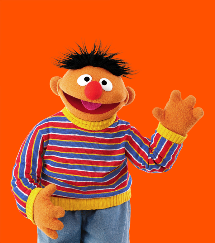 Ernie against an orange backdrop.