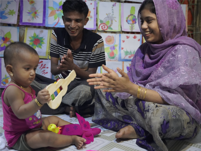 Teacher and child playing with musical instruments