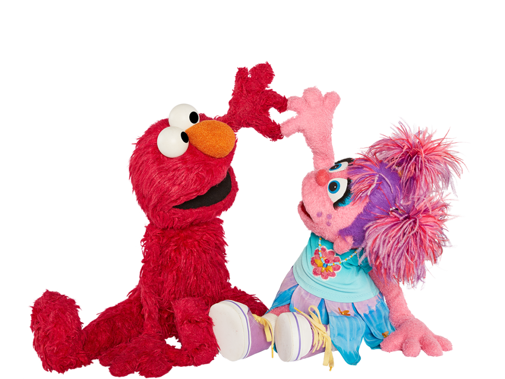 Elmo and Abby hold up their hands to form a heart