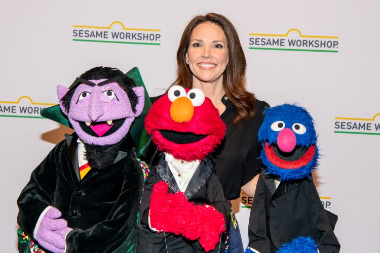 Erica Hill with Elmo, The Count and Grover