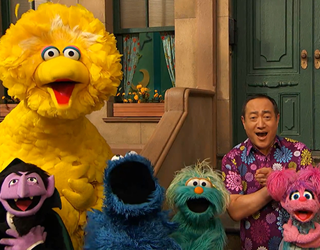 alan, big bird and other sesame street friends demonstrate hugging