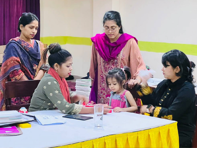 Providers working with a child at an event.